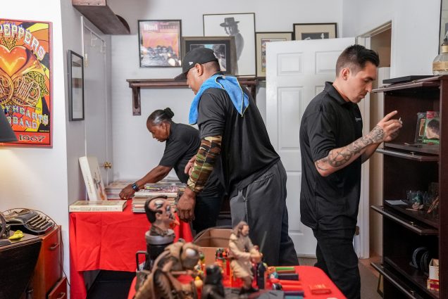 Grason employees work inside a home to stage it for an upcoming estate sale targeting motivated buyers